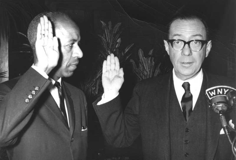 Dr. Dumpson taking oath