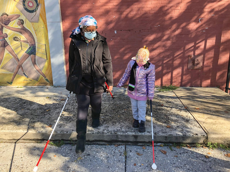 Clarissa learning how to use a cane