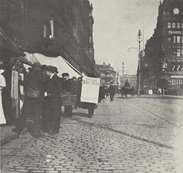 A sandwich board advertises Gregg Shorthand on Church Street in Liverpool, England. Circa 1888.