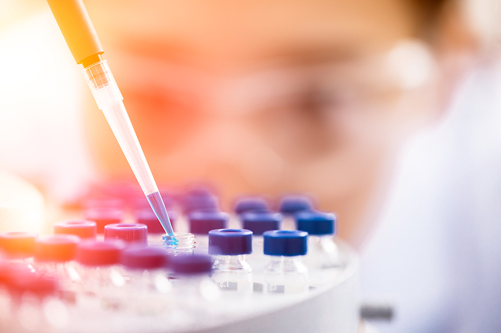 Female researcher at work in a medical lab.