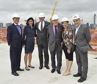 Shown at the QLIC topping out ceremony in October 2014 with everyone in hard hats (from left): Niko Elmaleh (World-Wide), Jennifer Rabina (Rabina Props.), Jim Stanton (World-Wide), Victor Elmaleh (World-Wide), Rachel Loeb (World-Wide), David Lowenfeld (World-Wide). Photo Credit: nyrej.com