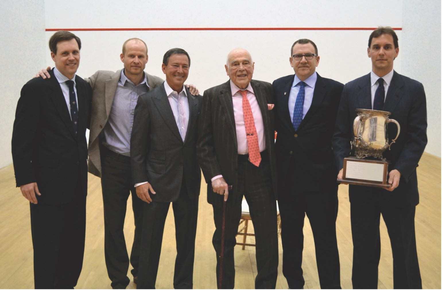 In April 2013, Victor Elmaleh became the oldest winner of the President’s Cup when he received the award at the World Doubles: (L-R) James Zug, Gary Waite, Niko Elmaleh, Victor Elmaleh, Peter Lasusa and Morris Clothier. Photo Credit: Squash Magazine