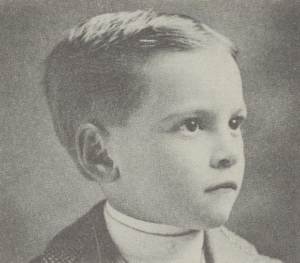 A portrait of Ralph Hayes as a child. As a little boy, still too young to attend school, he eagerly seized the daily newspaper to read the sports section.