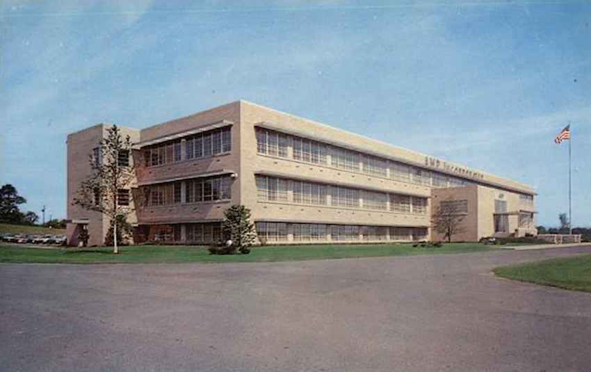 The exterior of the Administration building of AMP Inc., headquarters for the world-wide research, engineering and manufacturing facilities producing solderless terminals, precision application tooling and specialty wiring devices for electrical and electronic use. In effect, the solderless terminal center for the world. Photo credit: cardcow.com