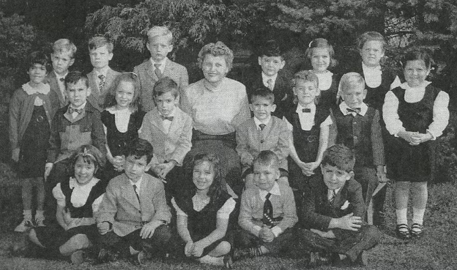 Donald Trump is seen standing next to his schoolteacher, Edna Lavey, top row, fourth from the left, with his Kindergarten class at Kew-Forest School. (Courtesy Paul Ornish). Photo source: The Washington Post