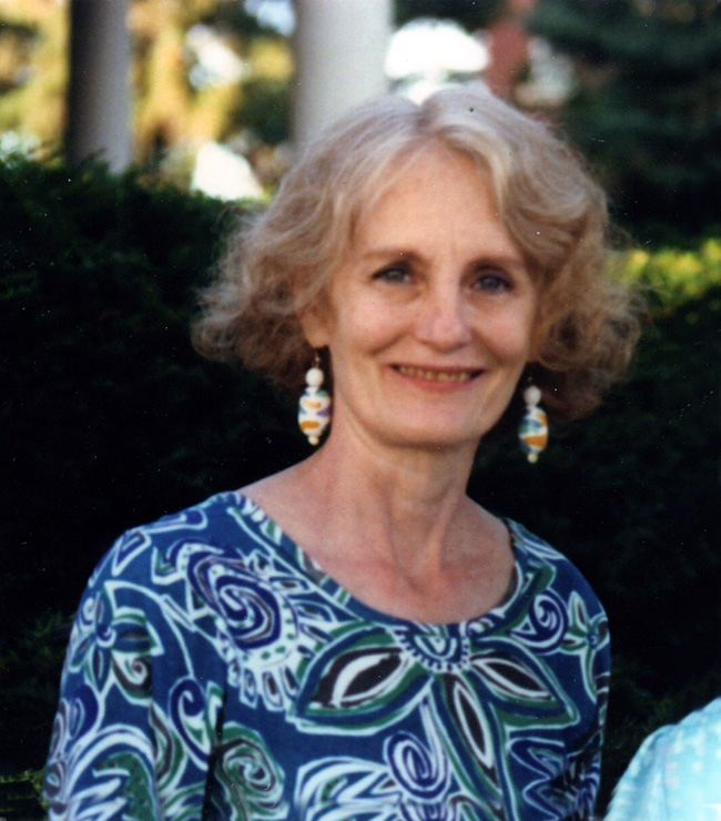 Family photo of Sandra Branch smiling outside.