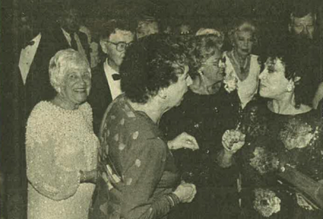 A group of ladies and gentleman chatting in a room. Talking during the reception are, from left, Deborah Cooley, Jean Stapelton, Lola Hanna and Patrice Munsel. The photo is from Nov. 27, 1988, Herald-Tribune.