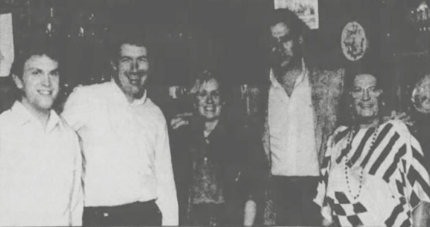 A group stands together. Mr. and Mrs. James Boyle of Longboat Key entertained Andrew Rawle, left, and Michael Dyer of the Minack Theatre in Porthcurno, Cornwall, England. With them are, left to right, Carol and Richard Angelotti and Lola Hanna, Asolo Theatre “Angels.” From the Bradenton Herald, Jan. 27, 1987.