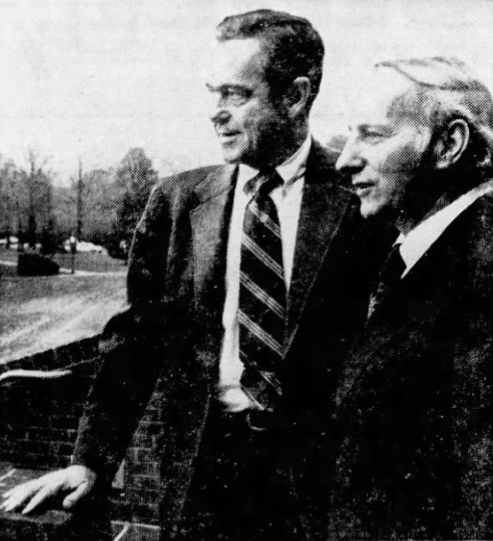 Adelphi University’s new president, Timothy Costello (right), looks at the Garden City campus, with Randall P. McIntyre (left).