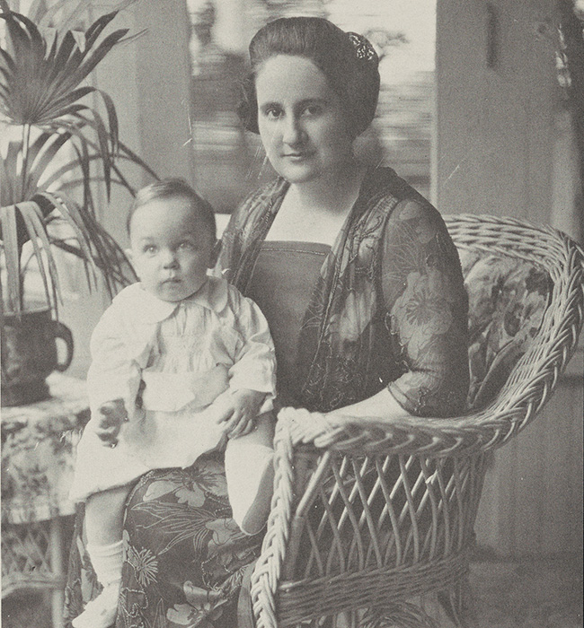 Florence Murphy with her first child, Tom Jr., sitting in her lap.