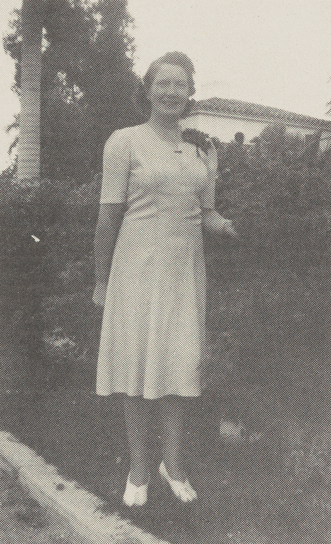 Sarah in Florida in the early 1940s, standing in a white dress outside.