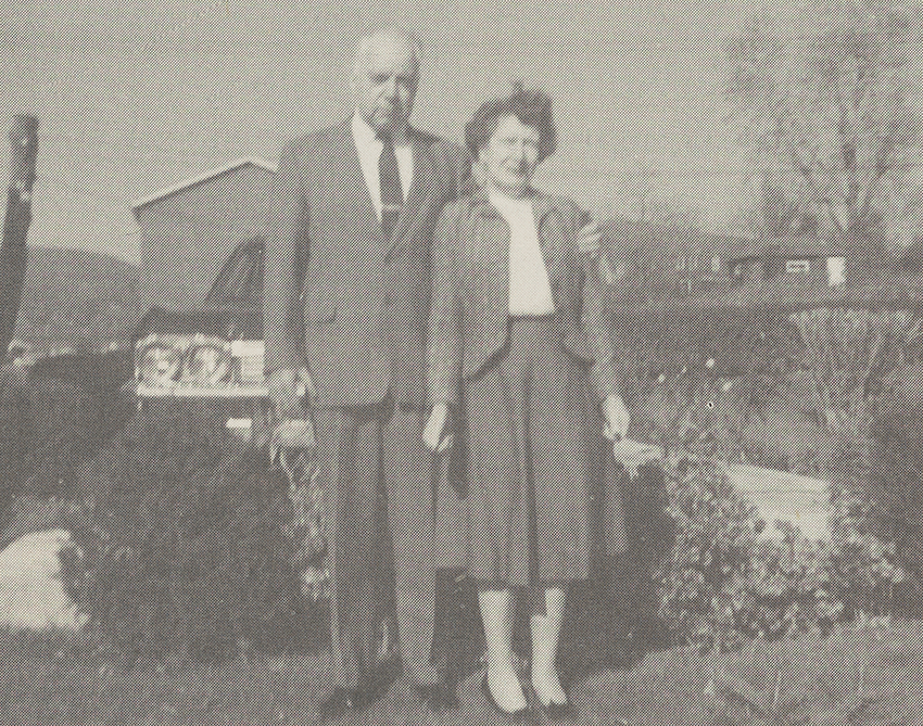 Harry (left) with his arm around Sarah (right) in 1967, as they stand outside.