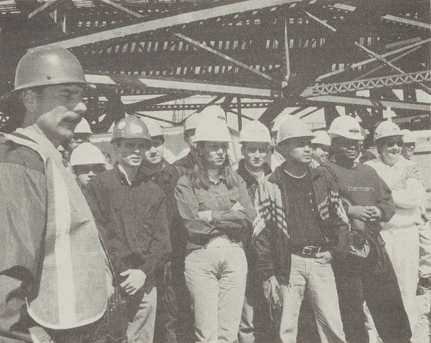 Students in hard hats on a spring field trip.