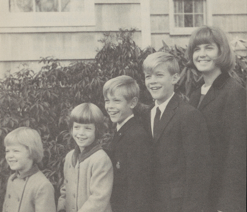 The West children in 1964 standing in front of a home and plant life: (from left to right) Jane, Selden, McDonald, Herbert, Jr., and Newill.