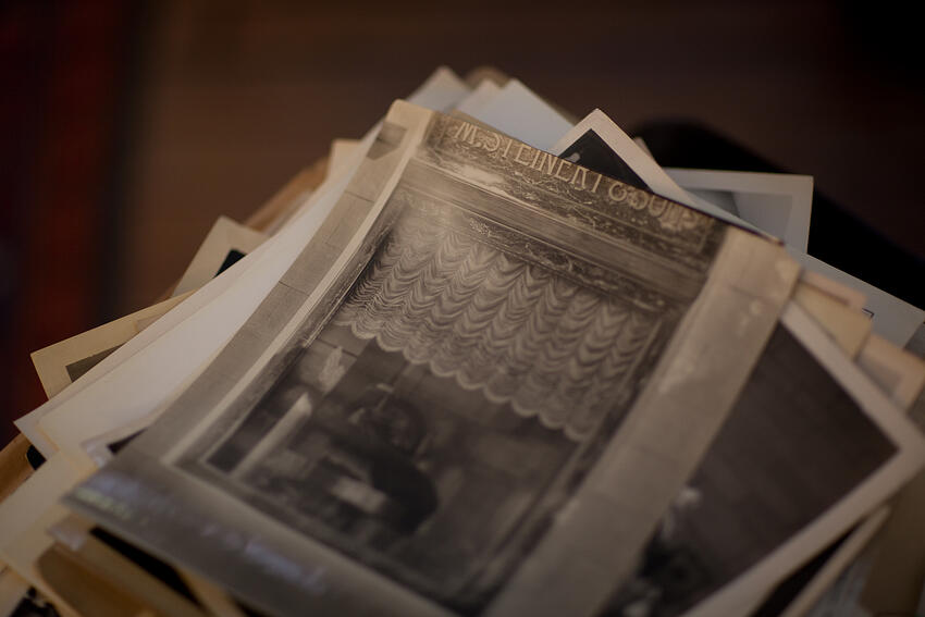 A stack of old photos. The top image says M. Steinert & Sons. Photo source: msteinert.com.