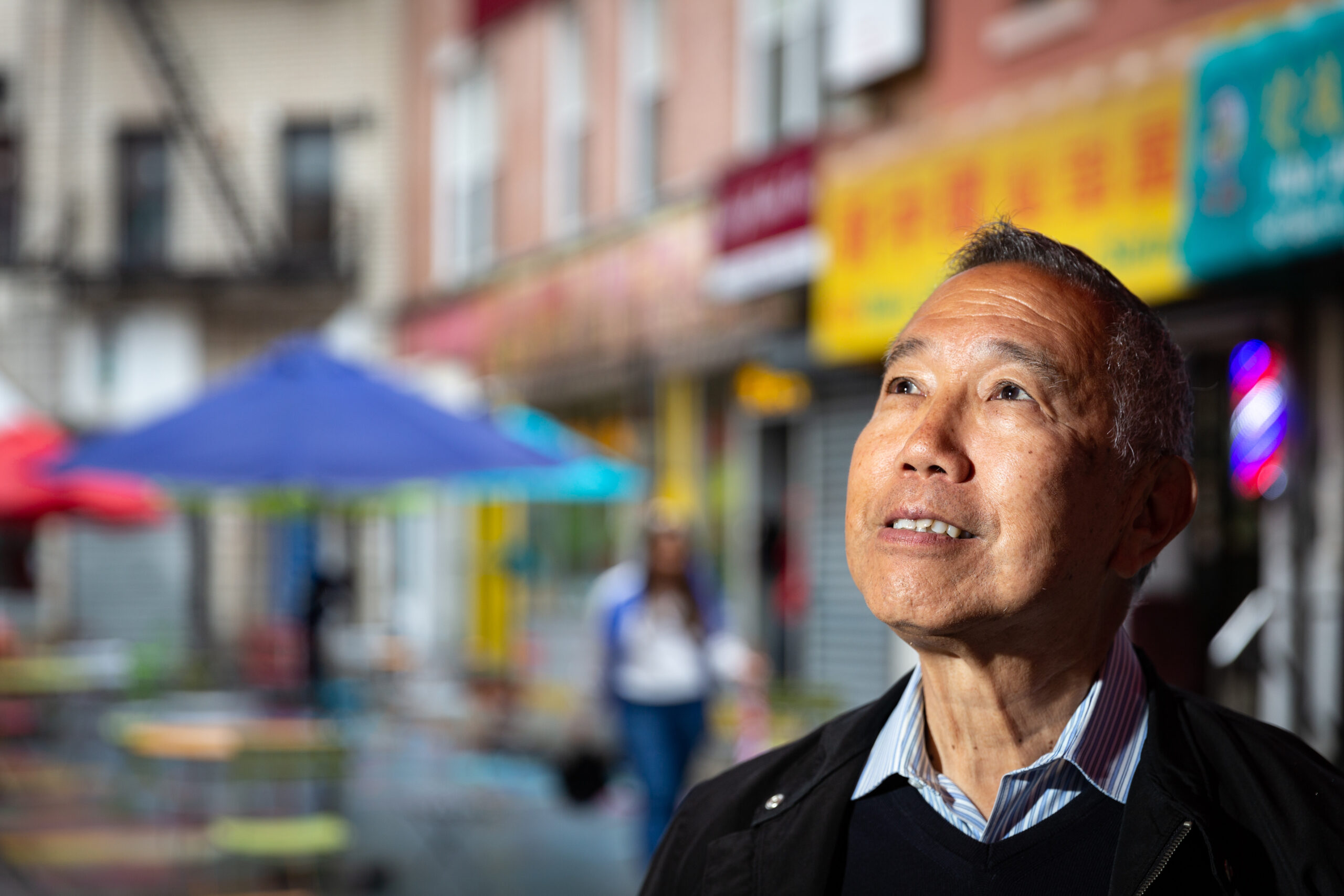 Trust donor Rocky Chin looks at his surroundings in Manhattan’s Chinatown.