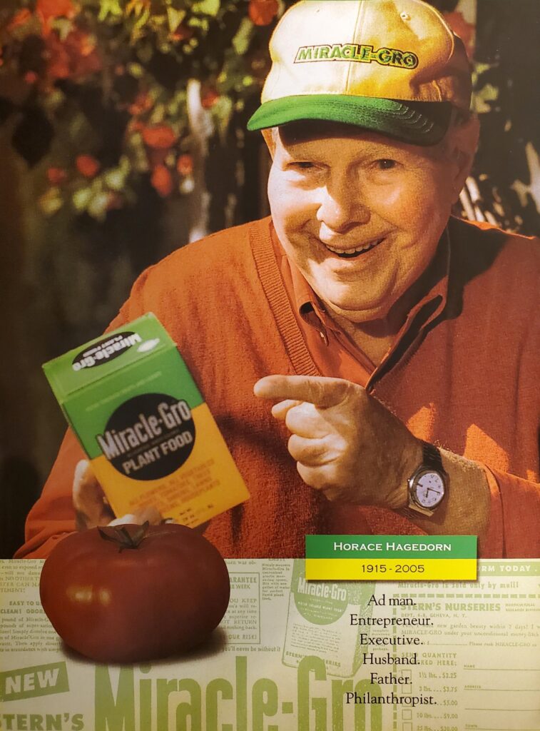 Horace Hagedorn holding a box of Miracle-Gro plant food.