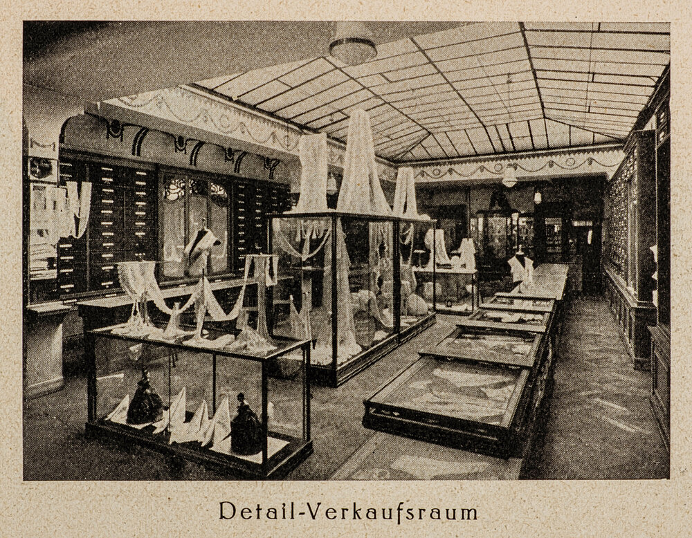 A 19th century view inside Rosa Klauber’s handmade lace business with the caption “Detail-Verkaufsraum.”