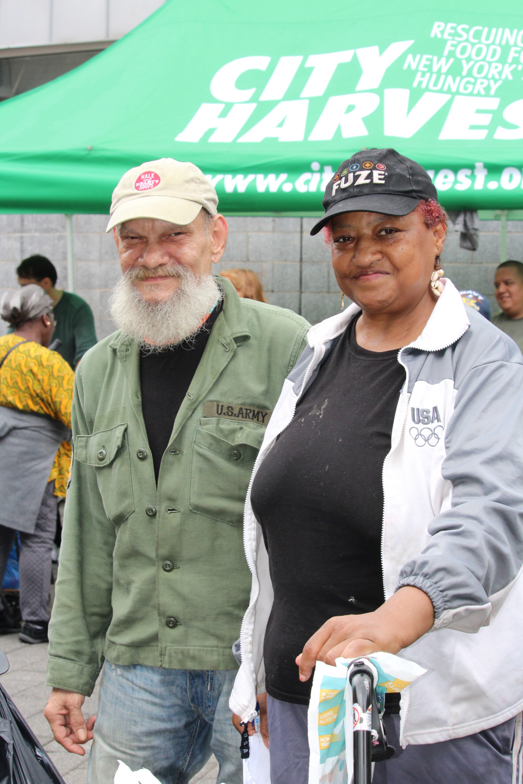 Two people attend a free mobile market in the Bronx. 