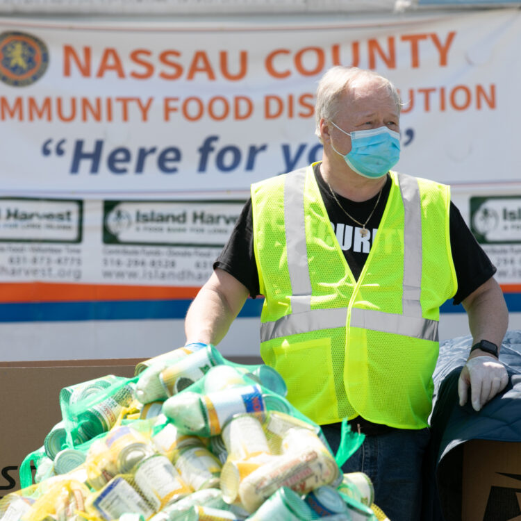 A volunteer organizing canned goods